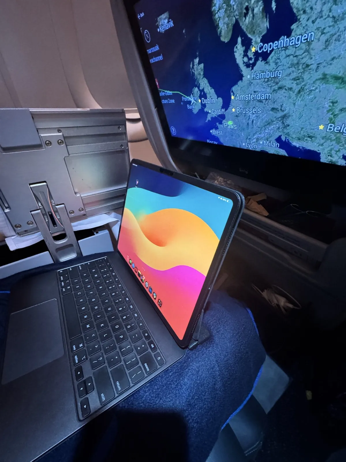 iPad with stabilizer in use on an airplane tray table