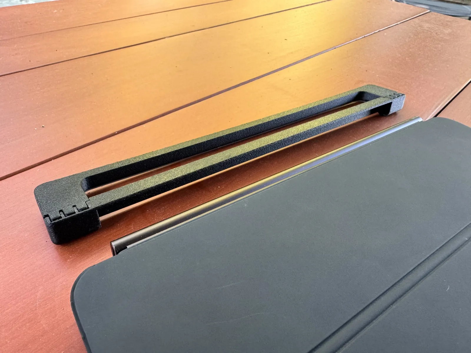 Tu Tash Magic Keyboard Stabilizer next to a Magic Keyboard